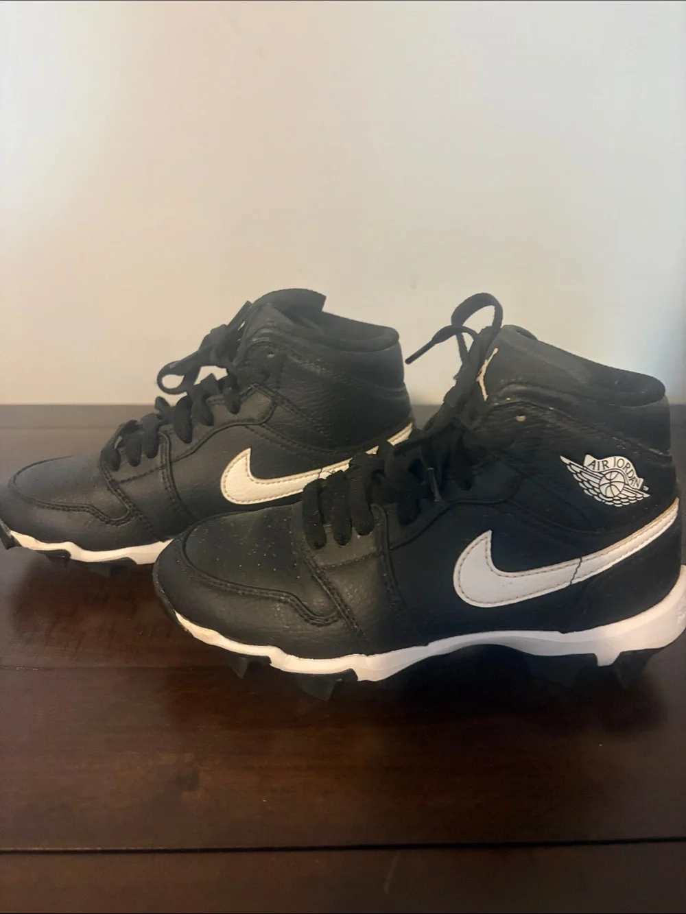Jordan 1 Mid Cleats. Kids' Black and White High-Top.